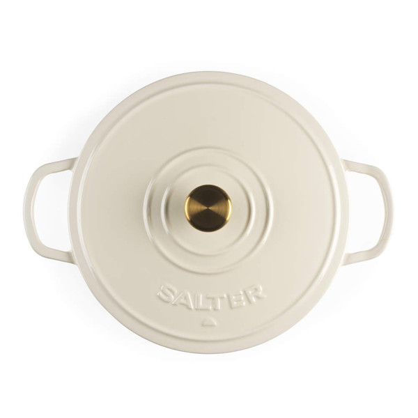 Cream cast iron casserole dish with lid, shown on hob with stew cooking