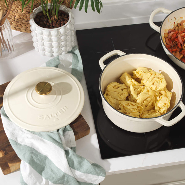 Cream cast iron casserole dish with handles, shown lid-on from above