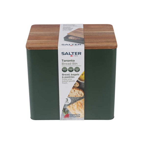 Green steel bread bin with acacia wood lid, shown in packaging.