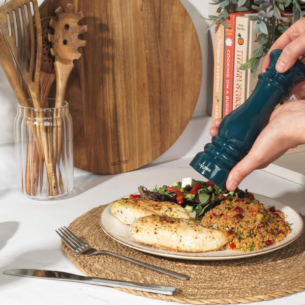 Green cast iron frying pan, Salter branding visible, shown base-up