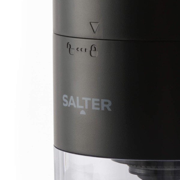 Close-up of black Salter electric grinder showing lock symbols and logo
