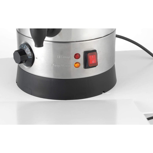 Stainless steel electric kettle base showing temperature dial and power switch