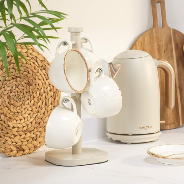 Four cream stoneware mugs on stand, with matching kettle, styled on kitchen worktop