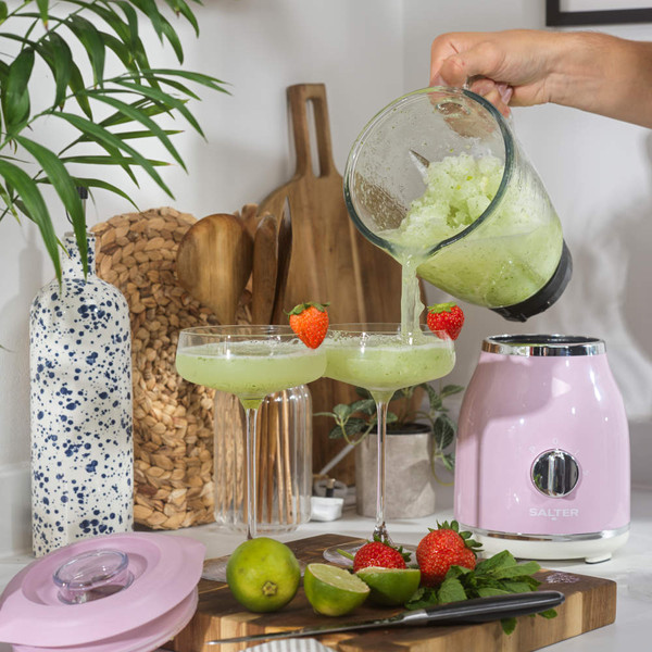 Pink jug blender with chrome dial, shown on white background