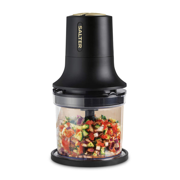 Black and gold electric food chopper with chopped vegetables in bowl, shown upright.