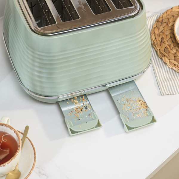 Sage green 4-slice toaster with chrome controls, shown from the front.