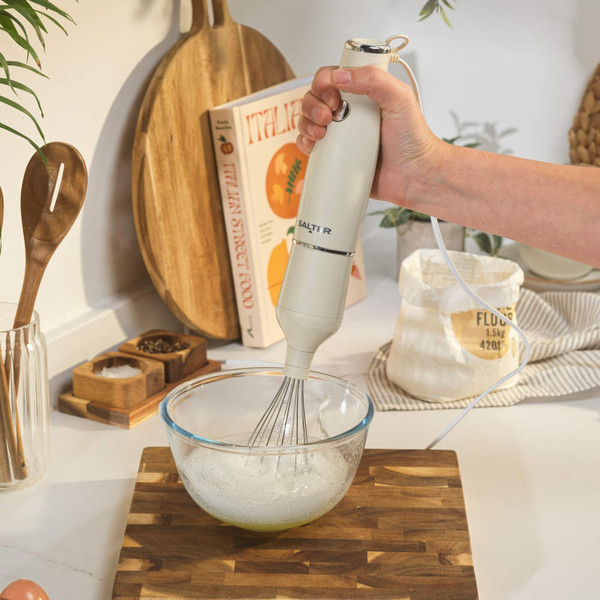 Cream cordless electric whisk with stainless steel balloon attachment