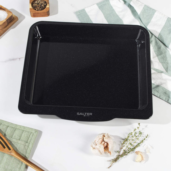 Black non-stick oven tray seen from above