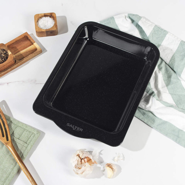 Black square roasting tin with curved edge, shown empty from above.