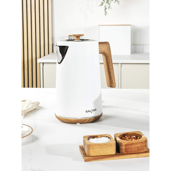 White electric kettle with wood-effect handle and base on kitchen counter