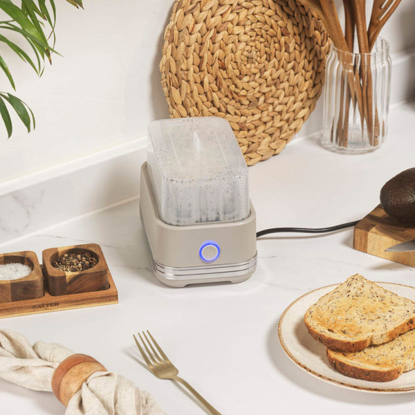 Taupe compact toaster in use on kitchen worktop