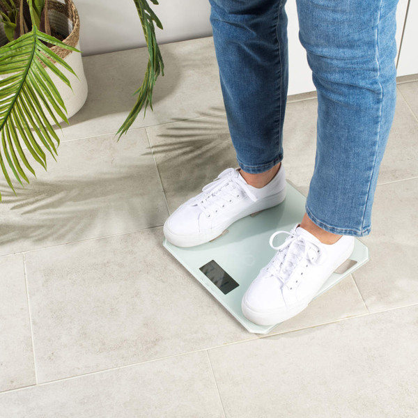 White digital bathroom scale, low profile side view