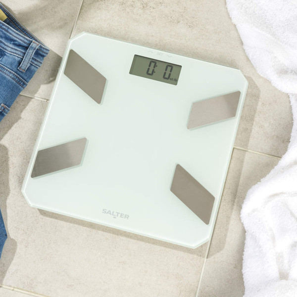 White Salter digital bathroom scale with black sensor pads, top-down view