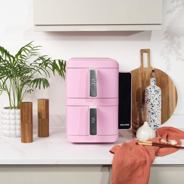 Side view of pink toaster oven with white handles