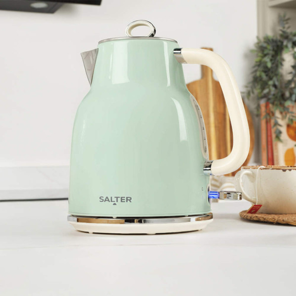 Pastel green electric kettle with cream handle on kitchen worktop