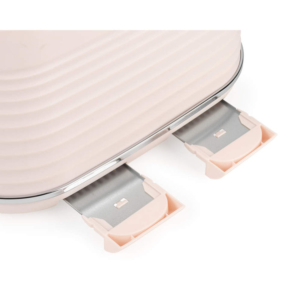 Close-up of pink toaster with two removable crumb trays extended