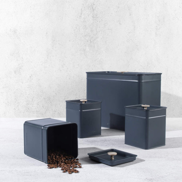 Set of matte black storage tins with lids, shown with coffee beans, for kitchen organisation