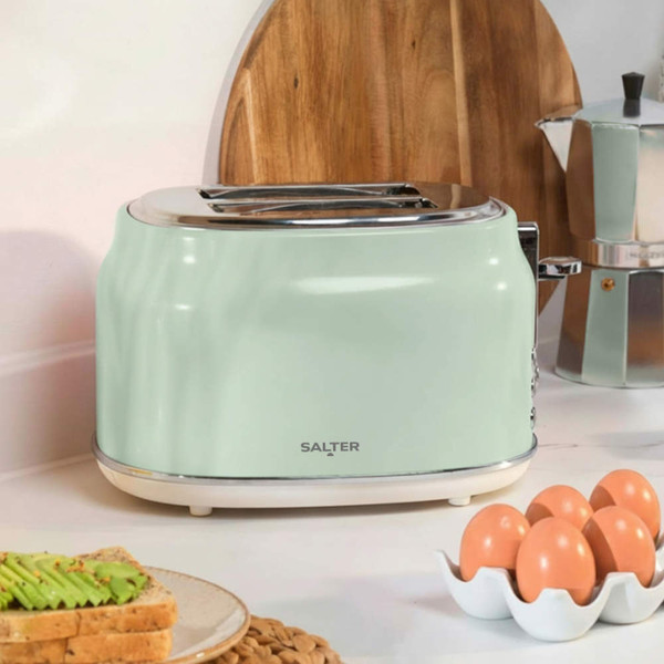 Mint green 2-slice toaster with chrome dials and buttons, angled view
