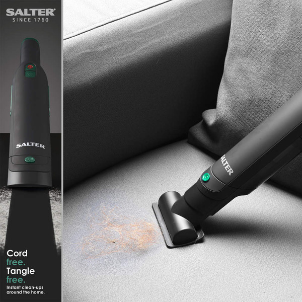 Salter cordless handheld vacuum cleaning pet hair from grey sofa