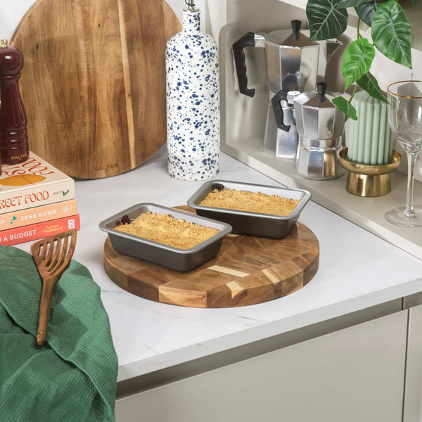 Set of two grey loaf tins with crumble topping in a modern UK kitchen scene