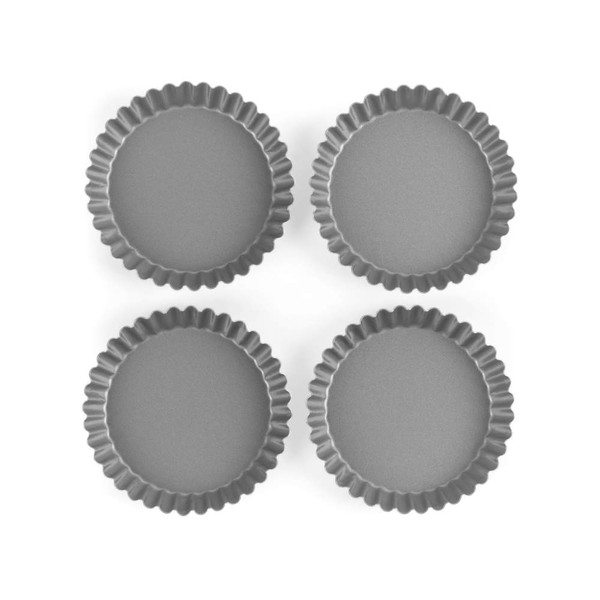 Set of four grey non-stick mini tart tins on white background
