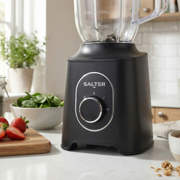 Salter blender pouring pink smoothie into jar in modern kitchen