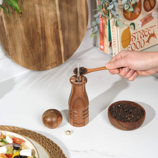 Wooden manual pepper mill with engraved Salter logo, shown upright.
