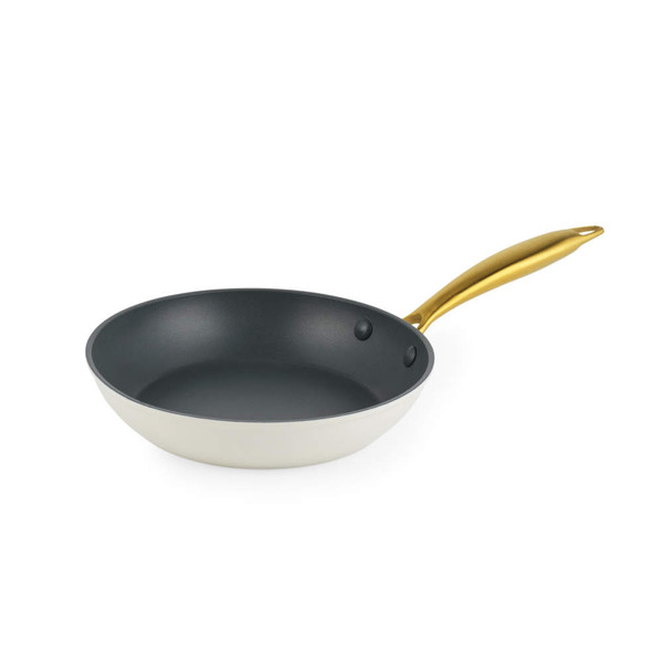 Cream frying pan with gold handle, shown angled on white background