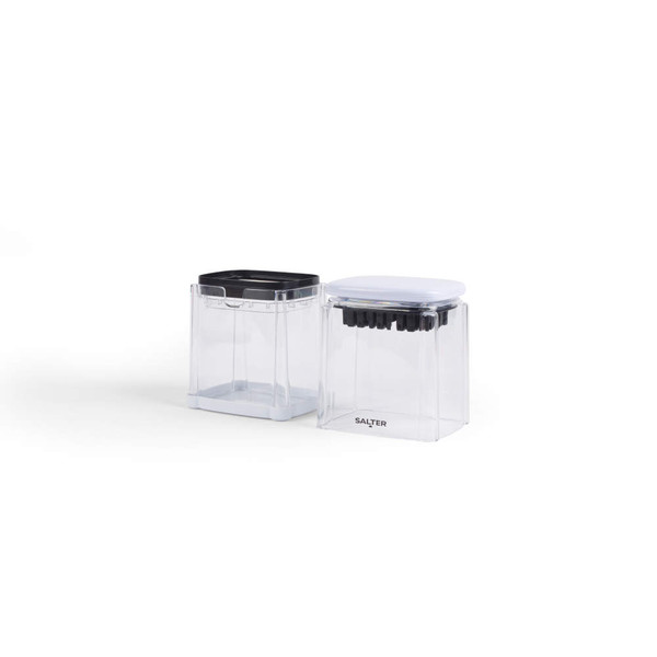 Set of two clear rectangular food storage containers with black and white lids, countertop view