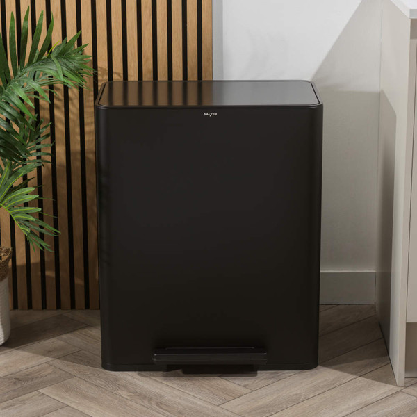 Black rectangular pedal bin with soft-close lid, shown in a modern kitchen setting
