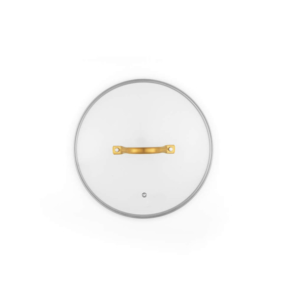 Clear glass pan lid with gold handle, shown from above