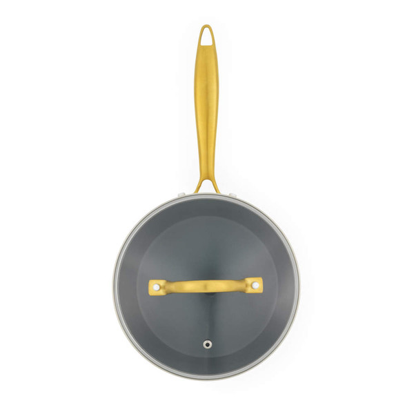 Cream saucepan with gold handle and lid, shown from above
