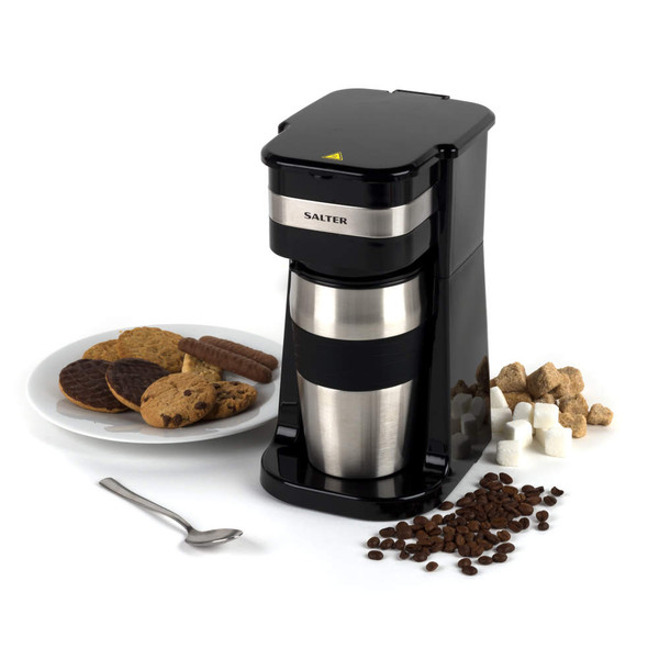 Salter single serve coffee maker in black with travel mug, shown with biscuits and coffee beans.