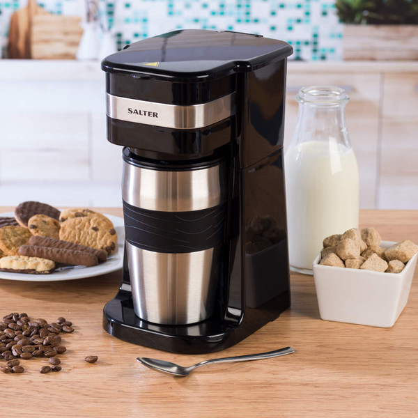 Salter single-serve black and silver coffee maker with travel cup, shown on kitchen counter.