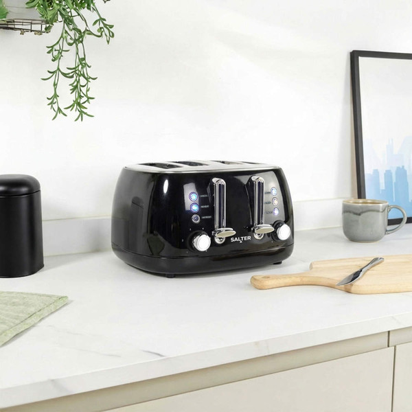 Black four-slice toaster on kitchen worktop