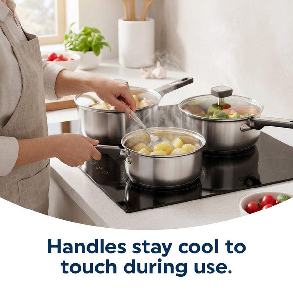 Stainless steel saucepan with glass lid, held by hand, filled with cooked potatoes