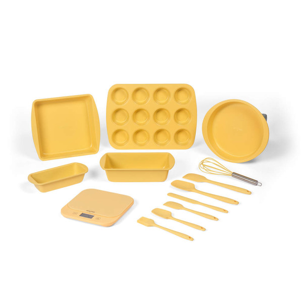 Yellow non-stick baking set including tins, utensils, whisk, and digital scale.