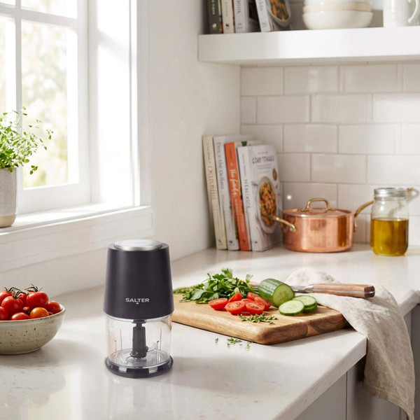Black Salter mini food chopper on kitchen counter beside chopped veg and cookbooks
