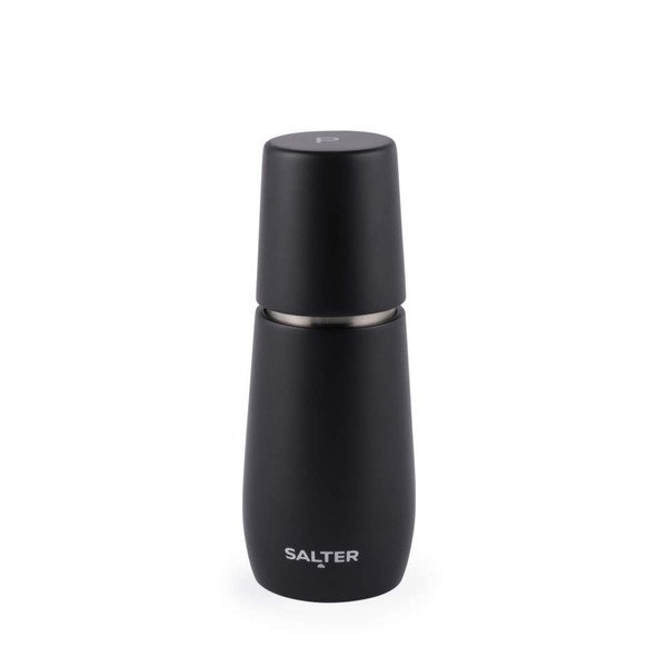 Black Salter pepper grinder on kitchen worktop next to bowl of peppercorns