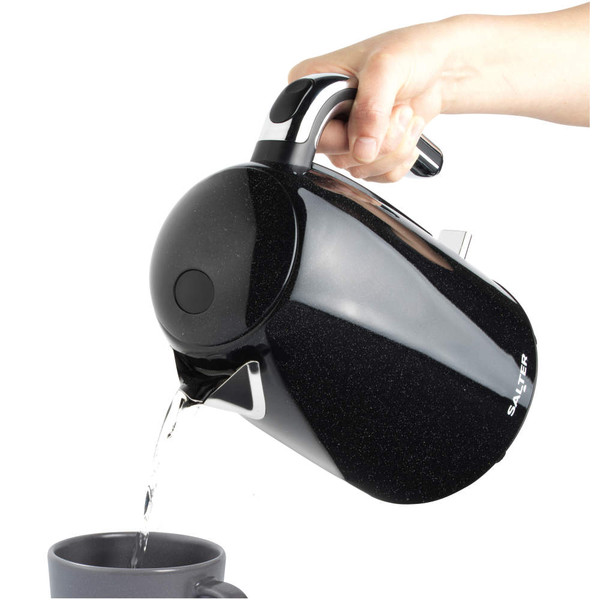 Black Salter kettle pouring hot water into a mug, shown in use.