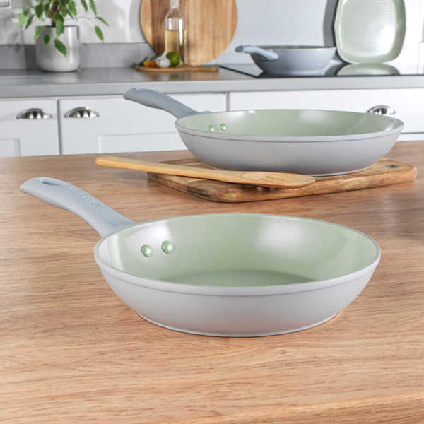 Grey and light green ceramic frying pan on kitchen worktop, ideal for everyday cooking