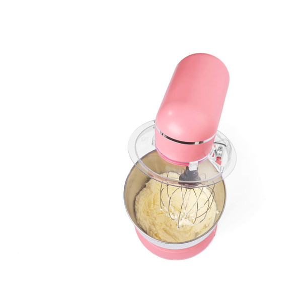 Pink stand mixer with bowl and whisk attachment mixing cake batter, top view