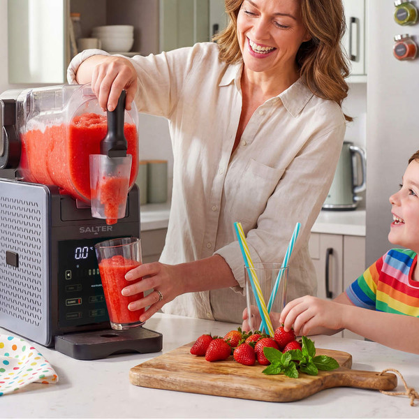 Salter slushie maker with orange slush in glass, highlights 2L or 5 cans capacity