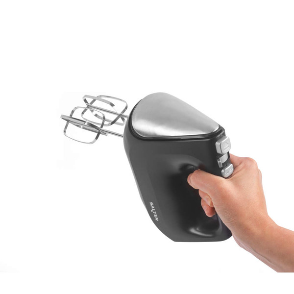 Hand holding black and silver electric hand mixer with twin beaters, product in use.