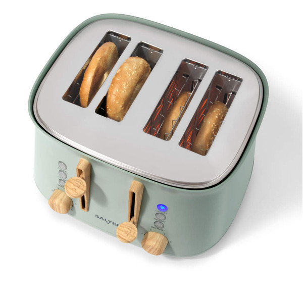 Sage green 4-slice toaster with wooden controls, sesame bagels toasting inside