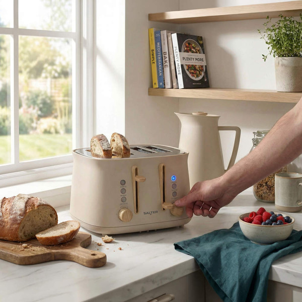 Stone-coloured 4-slice toaster in use, with artisan bread toasting on a kitchen counter