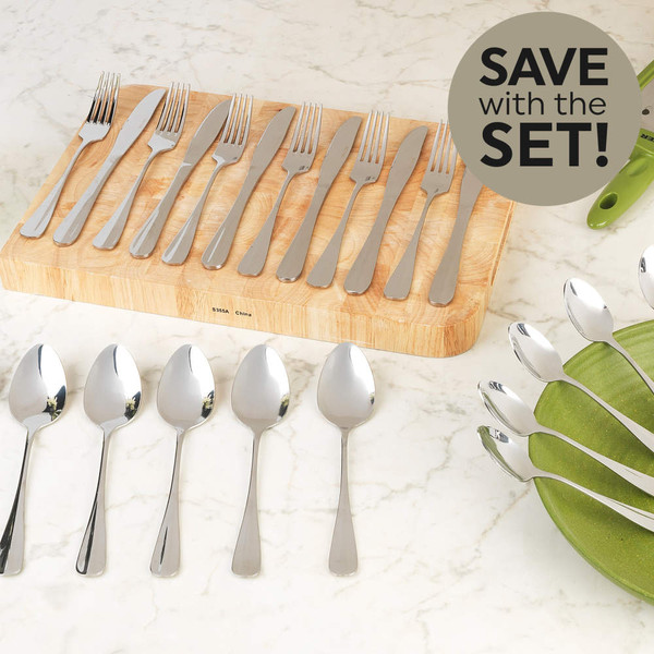 Stainless steel cutlery set with spoons, forks, and knives displayed on table.
