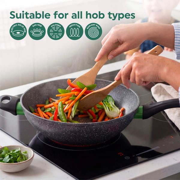 Non-stick frying pan with vegetables on induction hob, suitable for all hob types