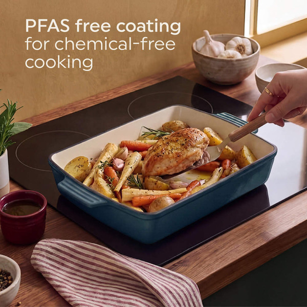 Roast chicken with mixed root vegetables in ceramic dish, top view