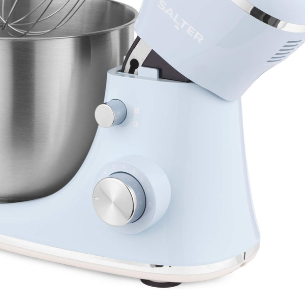 Light blue stand mixer with stainless steel bowl, showing control dial and lock button
